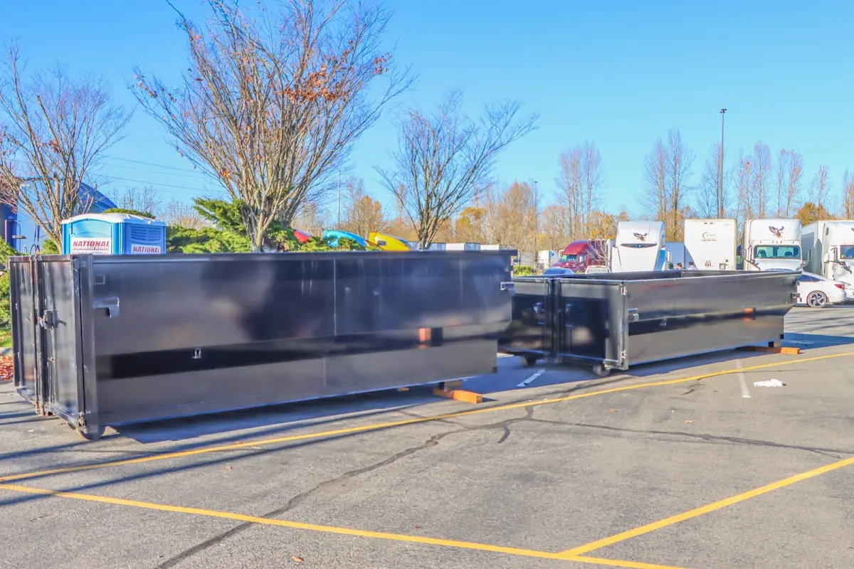 Professional dumpster rental service with roll-off container on residential driveway in Templeton